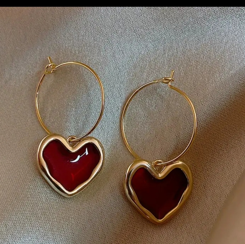 Gold tone hoop heart earrings
